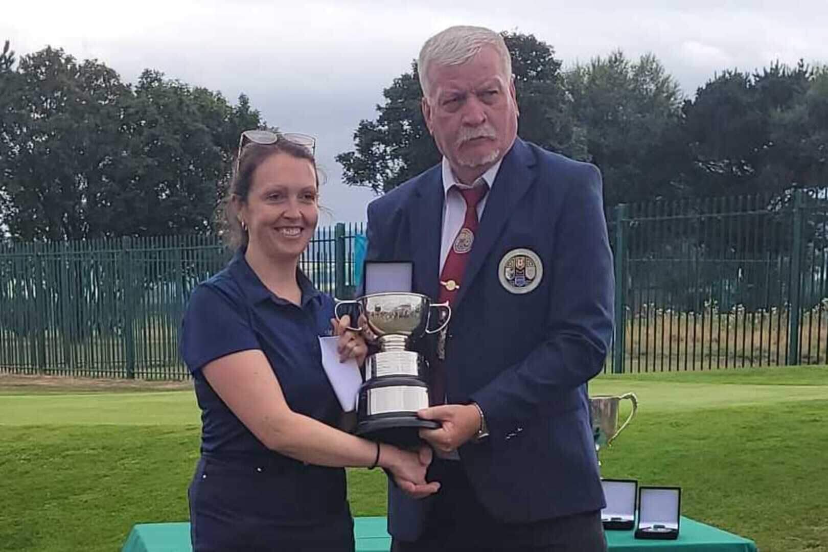 Deerpark Pitch & Putt Club's Ciara Lowe who won the National Ladies Intermediate Strokeplay Championship receiving the Cup from Pitch & Putt Ireland President Davy Reddin at Cunnigar Pitch & Putt Club, Dungarvan, Co Waterford last Sunday at the official presentation.